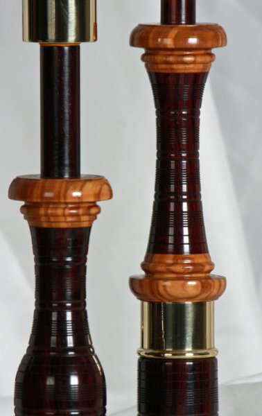 Original profile in cocobolo with Olive wood projecting mounts, and bronze beaded ferrules.